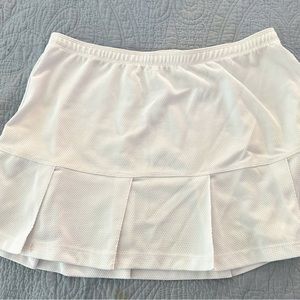 6 tennis skirts and accessories, All M, except lighter blue skirt L.
